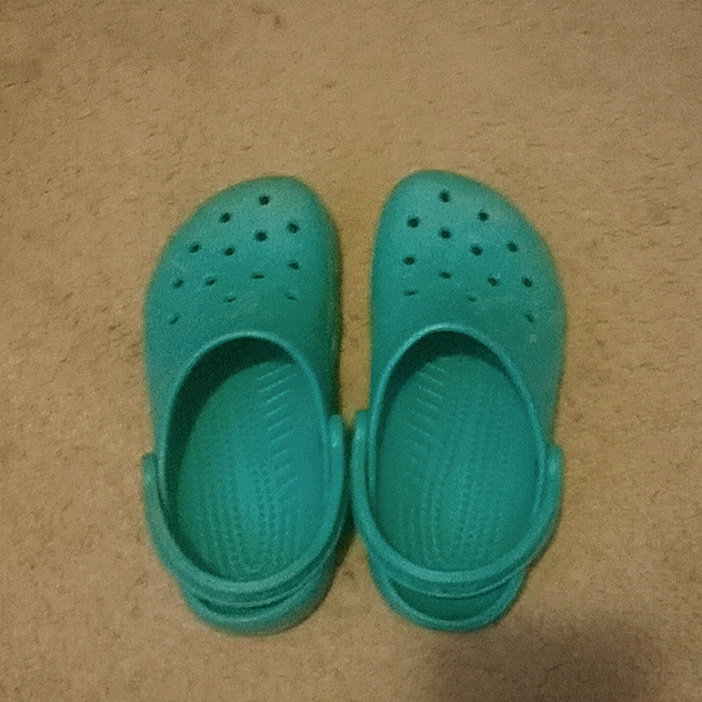 Teal colored Crocs size 6